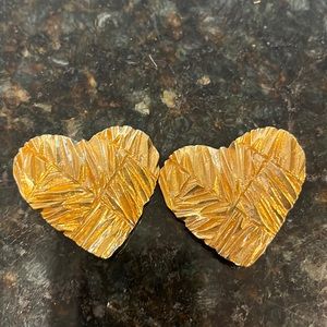 Ysl gold clip/on heart shaped earrings. Textured design.
